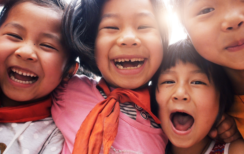 Multiracial children embracing childhood.